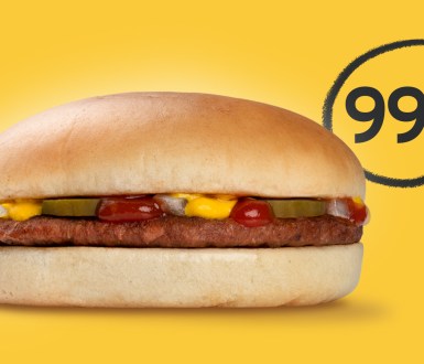 Burger in bun on yellow background with 99p in black behind