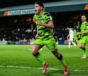 Forest Green Rovers run on the football pitch
