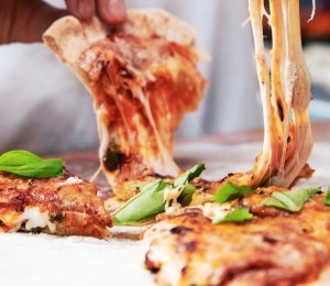Pizza with cheese made from milk proteins using microorganisms instead of cows
