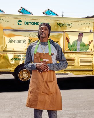 Snoop Dogg standing in front of a Beyond Meat food truck