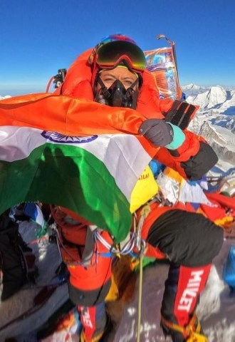Prakriti Varshney holds the Indian flag at the top of Everest